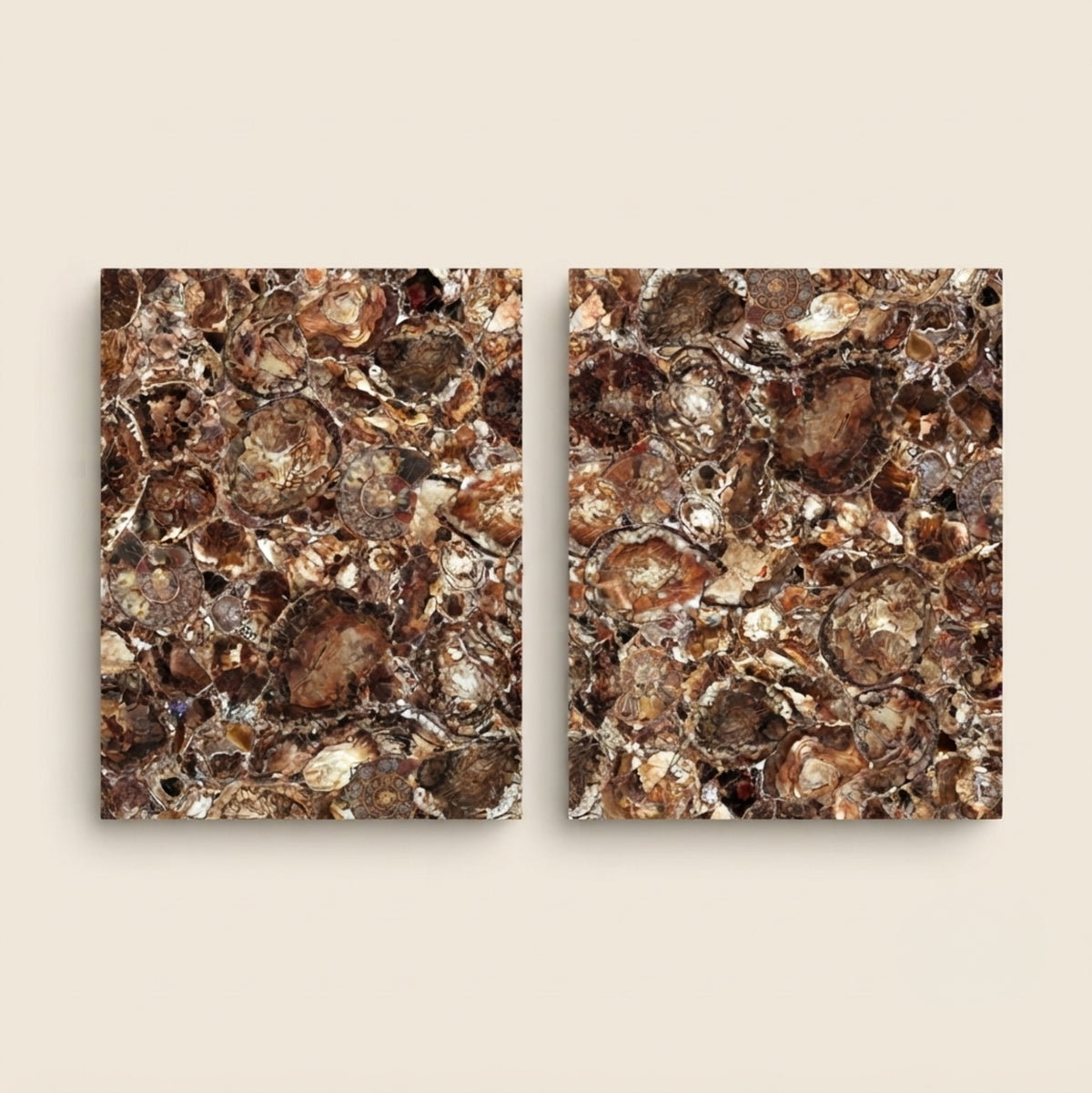 Two square abstract wall art panels with a textured, metallic-looking pattern in brown, bronze, gold, and copper tones, displayed side by side on a light beige background.