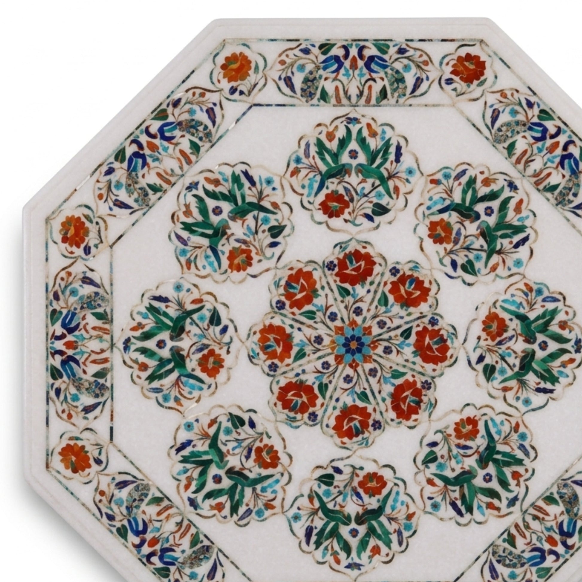 An octagonal ceramic tile featuring a white background decorated with intricate hand-painted floral motifs in orange, green, blue, and red.