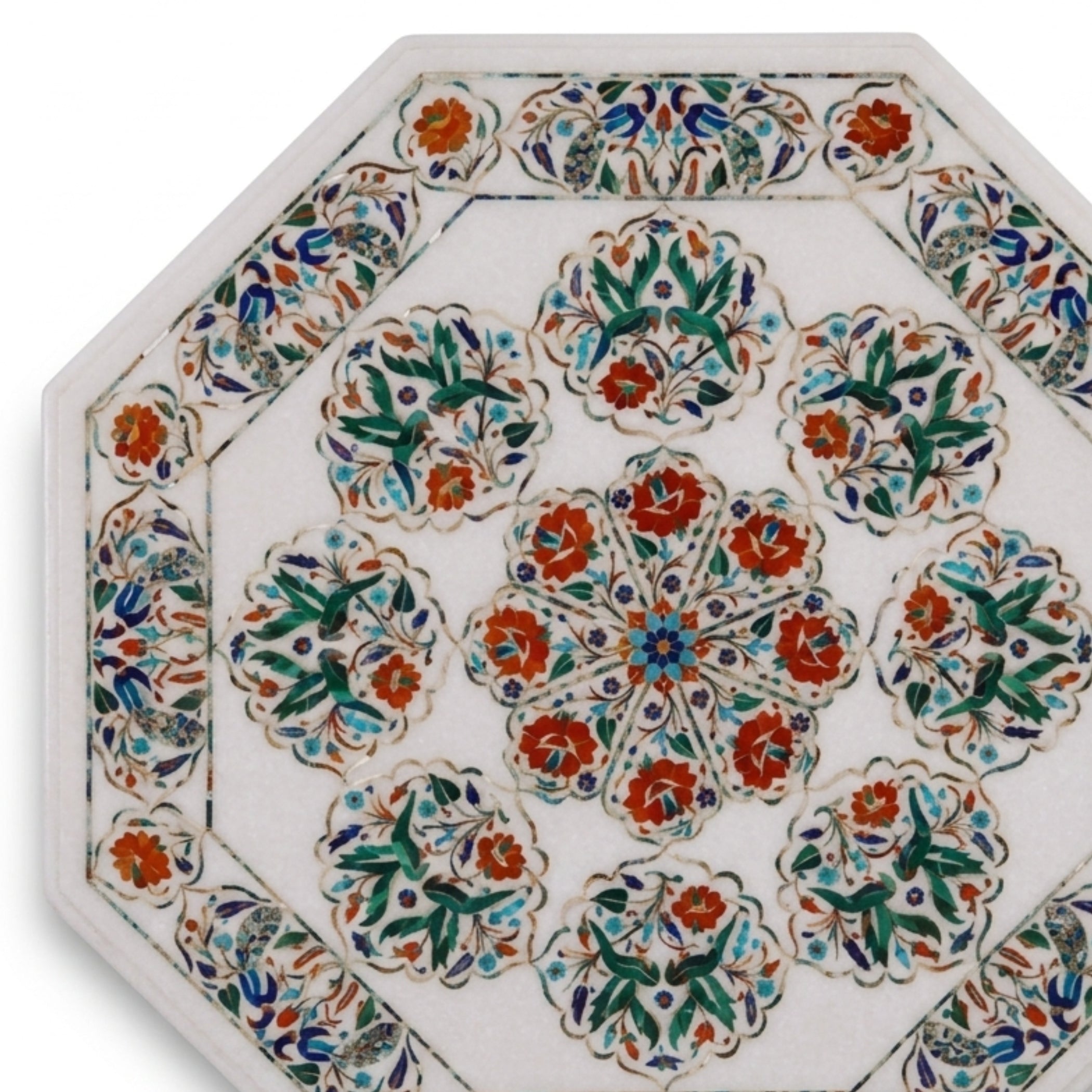 An octagonal ceramic tile featuring a white background decorated with intricate hand-painted floral motifs in orange, green, blue, and red.