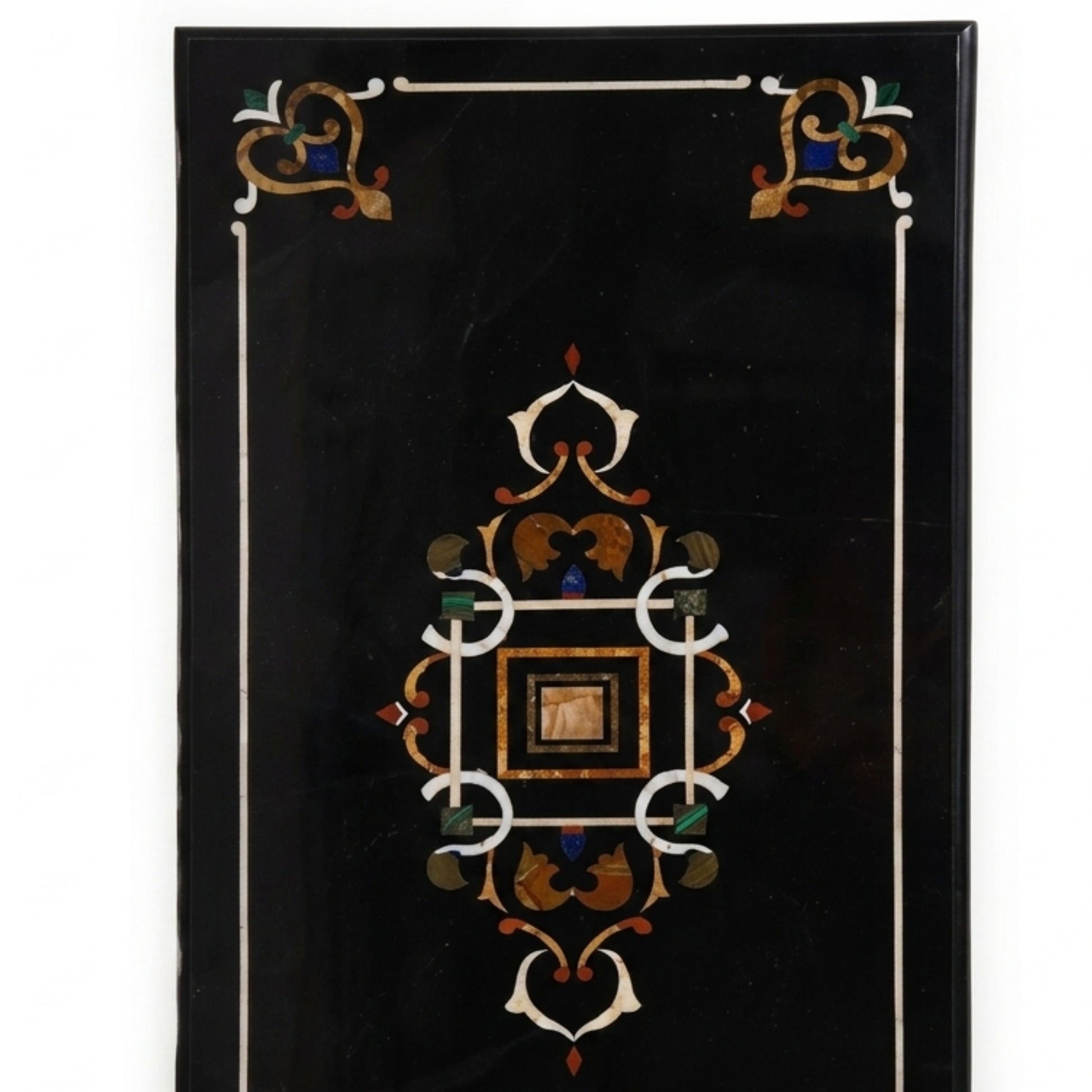 Close-up of handcrafted Pietra Dura floral inlay on a premium Black Marble Coffee Table made by skilled artisans.