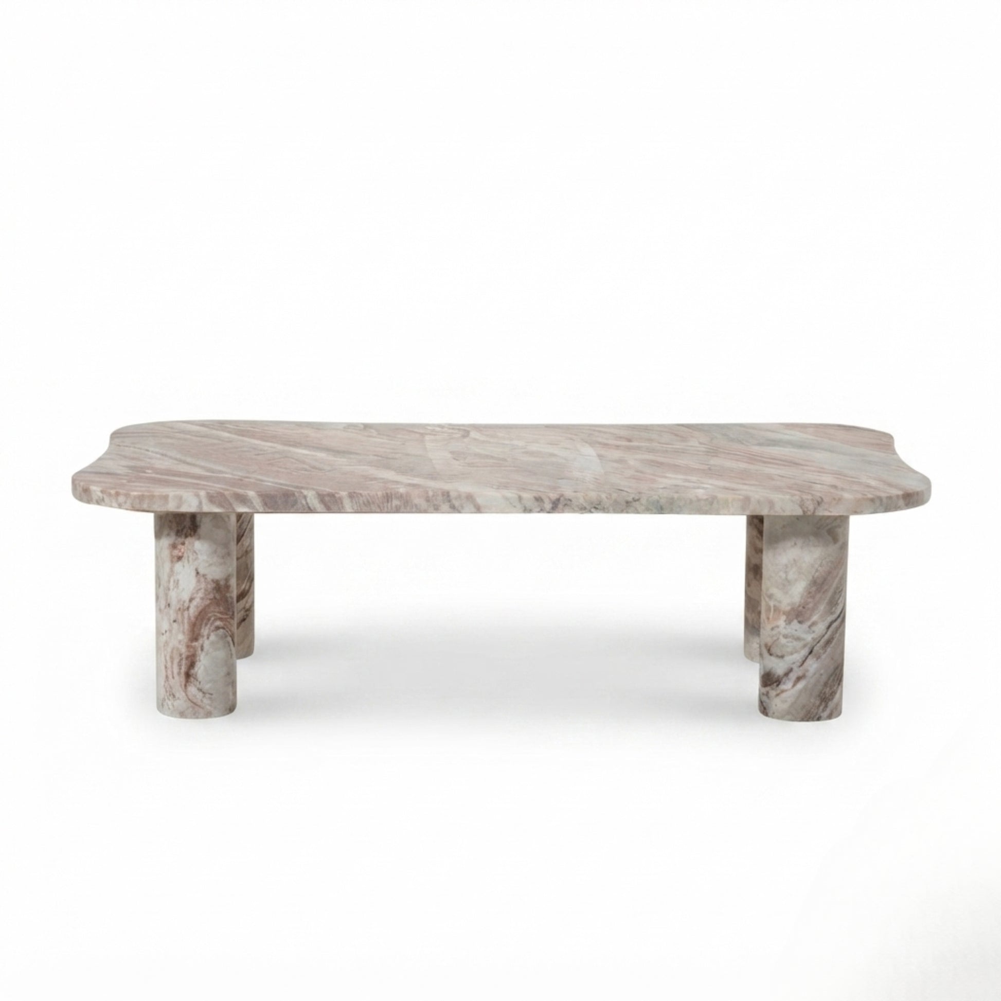 A modern low coffee table made of natural pinkish-gray marble with distinctive wavy edges and cylindrical block legs, shown against a plain white background.