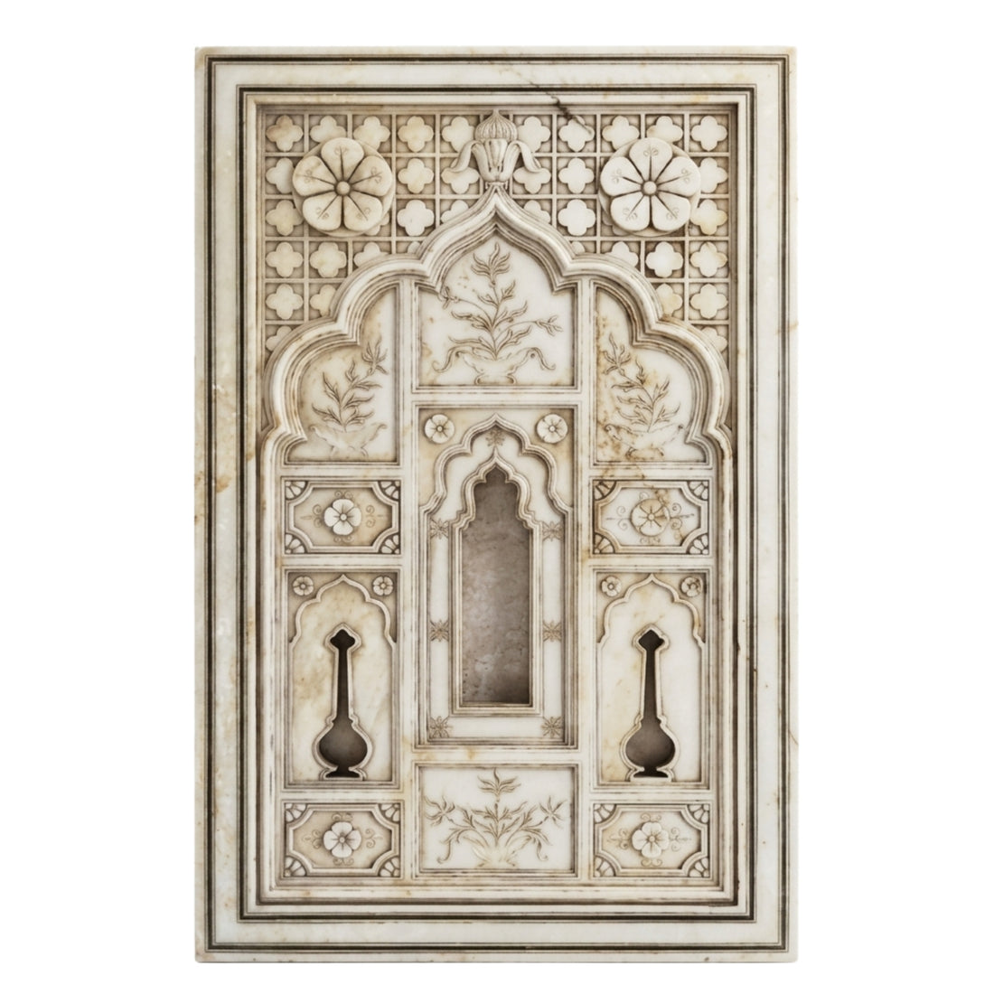 An ornate rectangular carved stone wall panel with intricate floral and geometric patterns, mounted on a beige plaster wall.