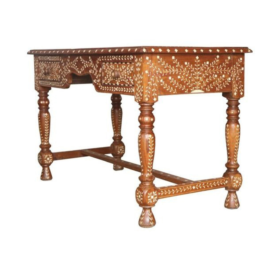 An ornate carved wooden table with turned legs and intricate floral inlay details, shown against a plain white background.