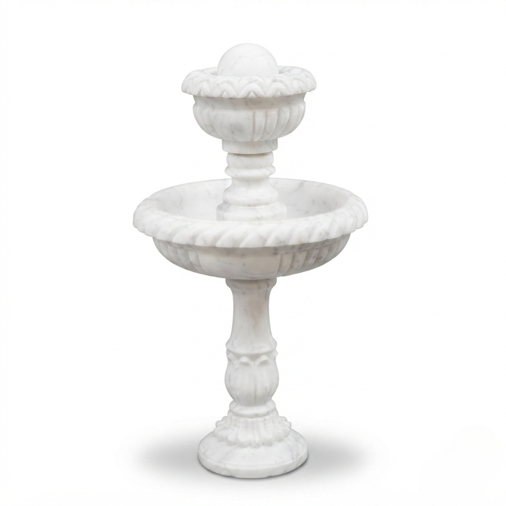 A white marble-style two-tier garden fountain with decorative carved details, shown on a clean white background.