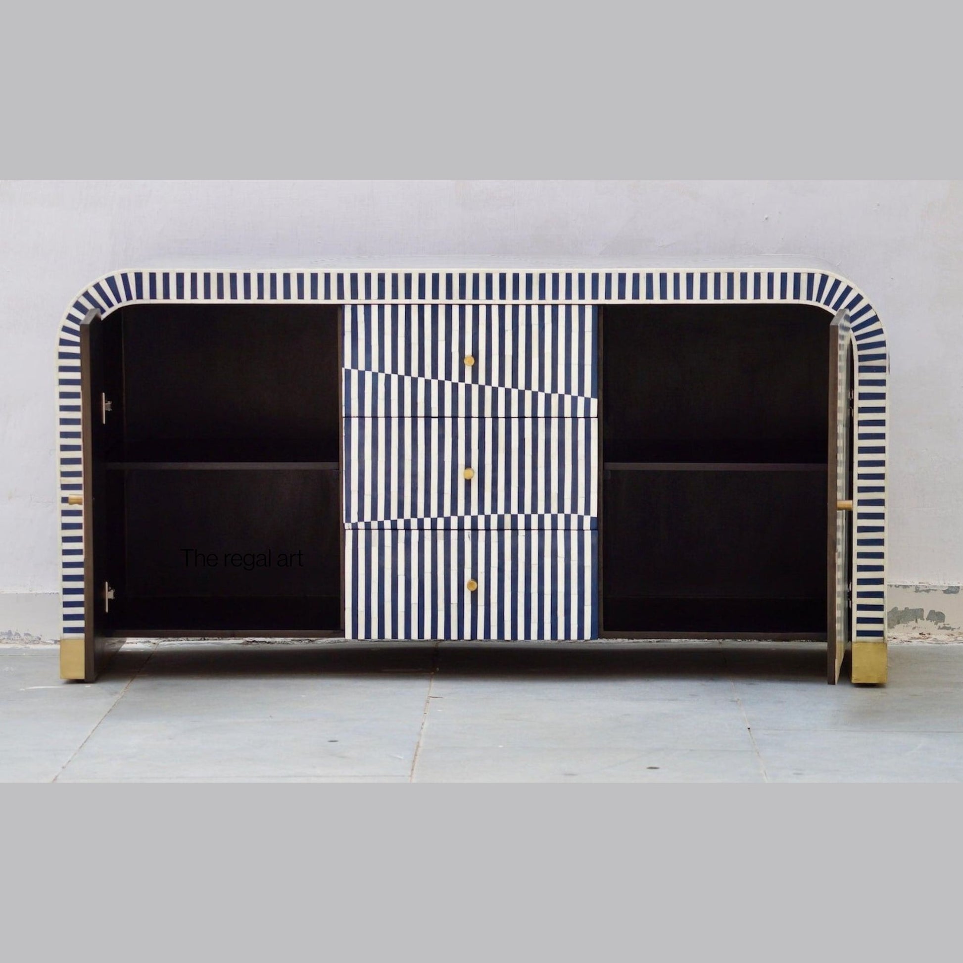 Modern cabinet with black and white striped design on a plain background