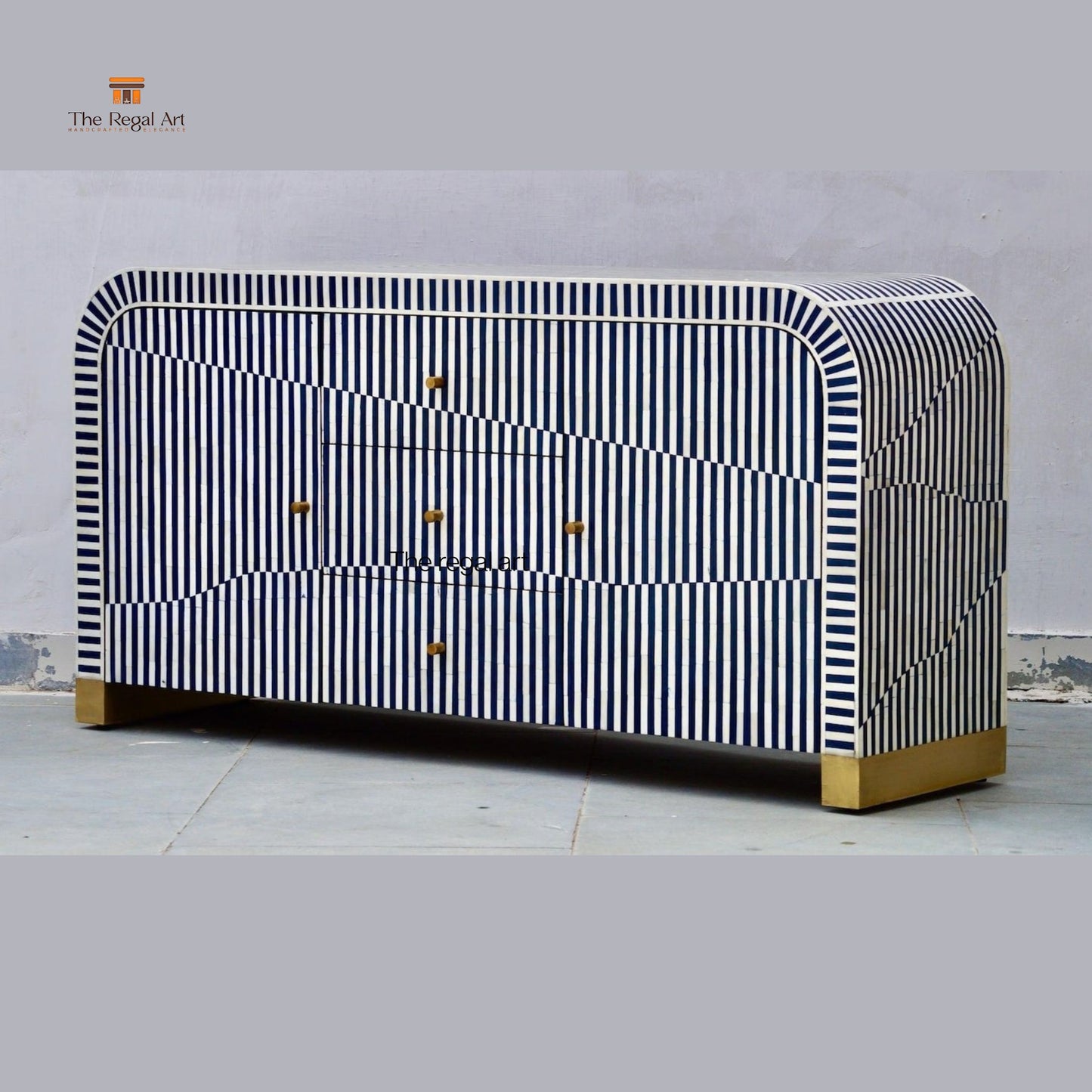 Striped dresser with gold accents on a gray background