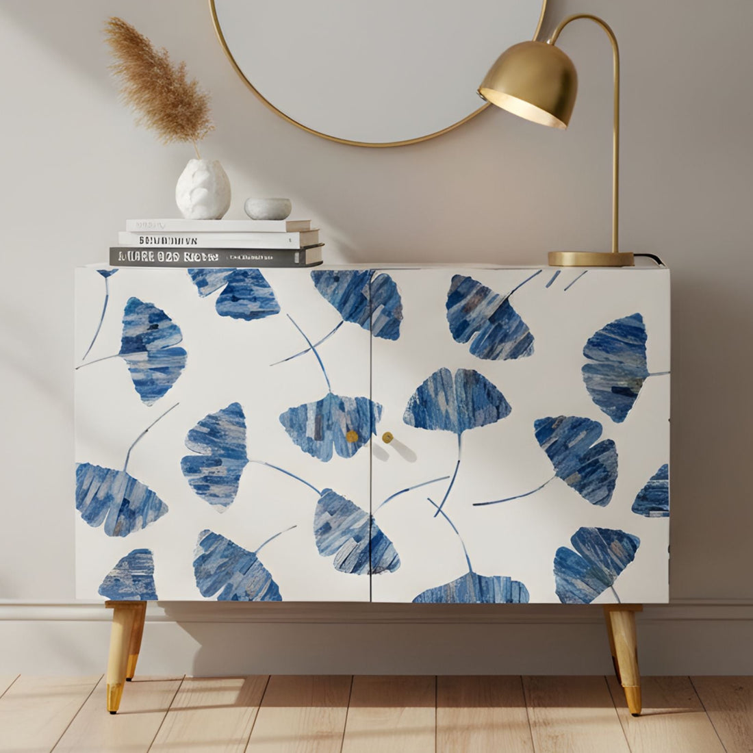 Cabinet with blue leaf pattern in a room with a mirror and lamp.