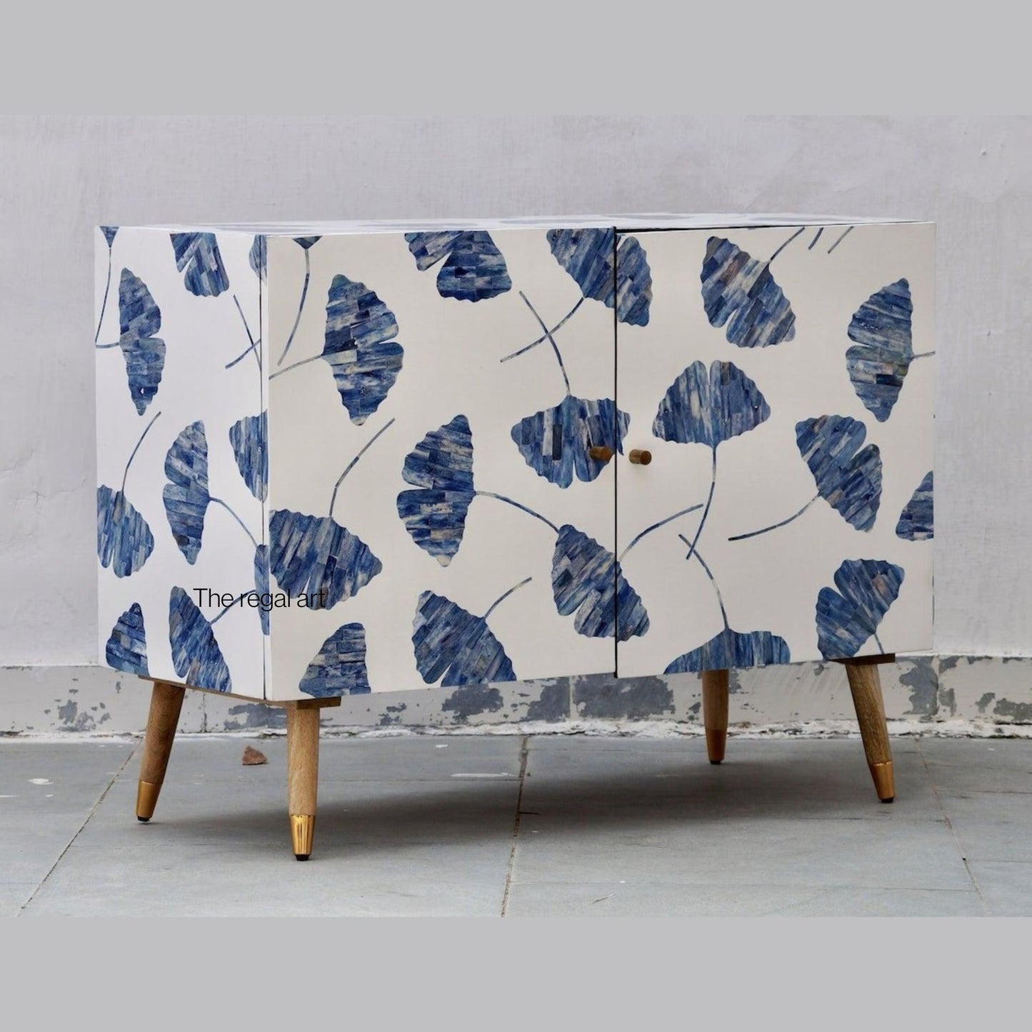 Cabinet with blue leaf pattern on a gray background