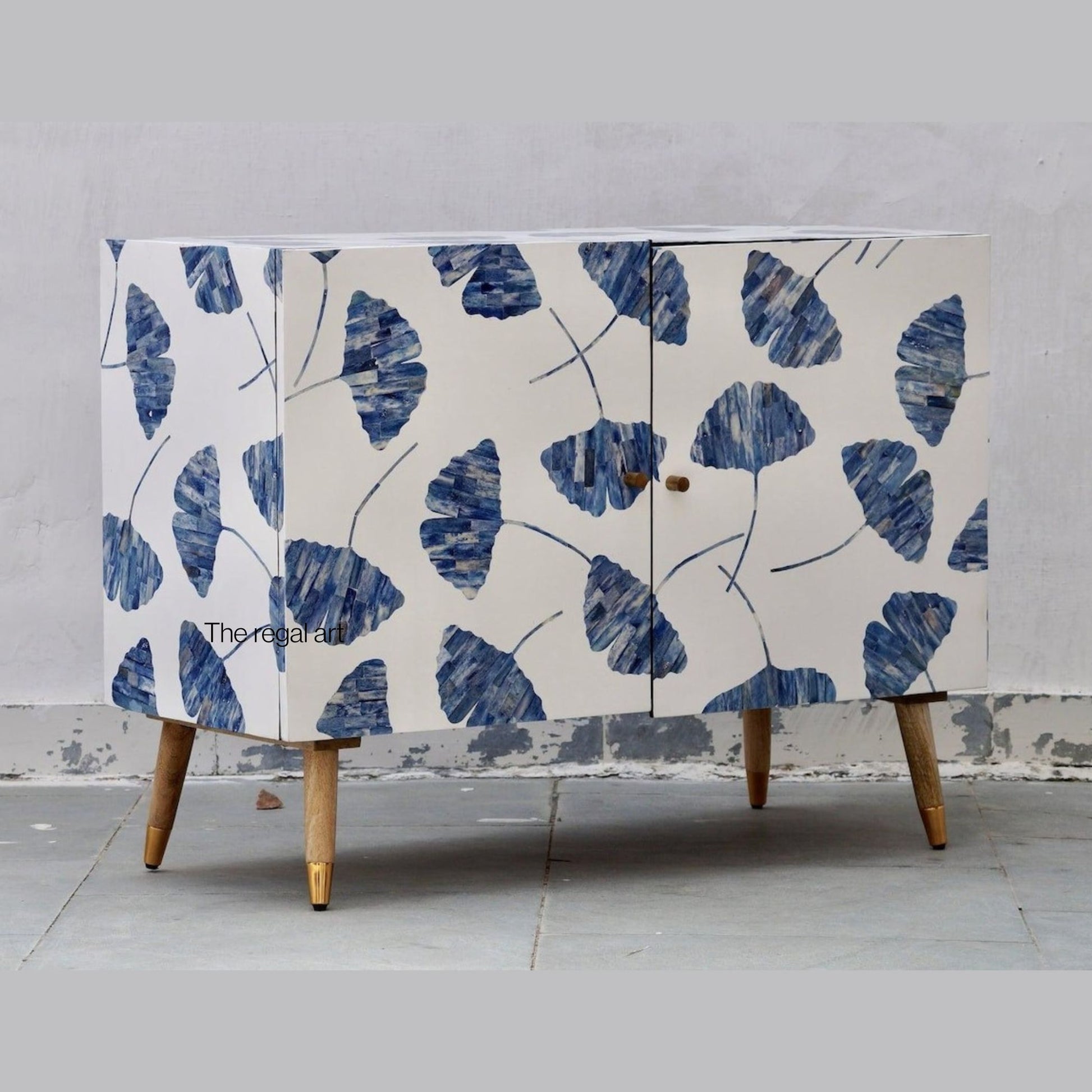 Cabinet with blue leaf pattern on a gray background