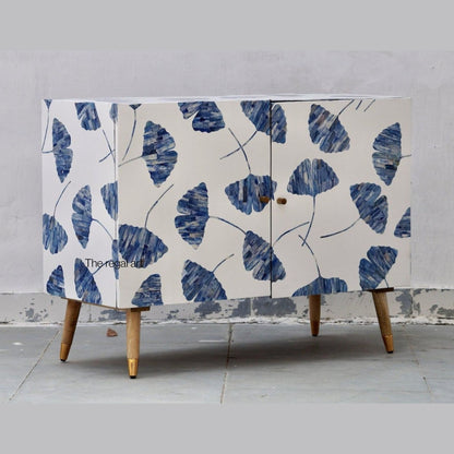 Cabinet with blue leaf pattern on a gray background
