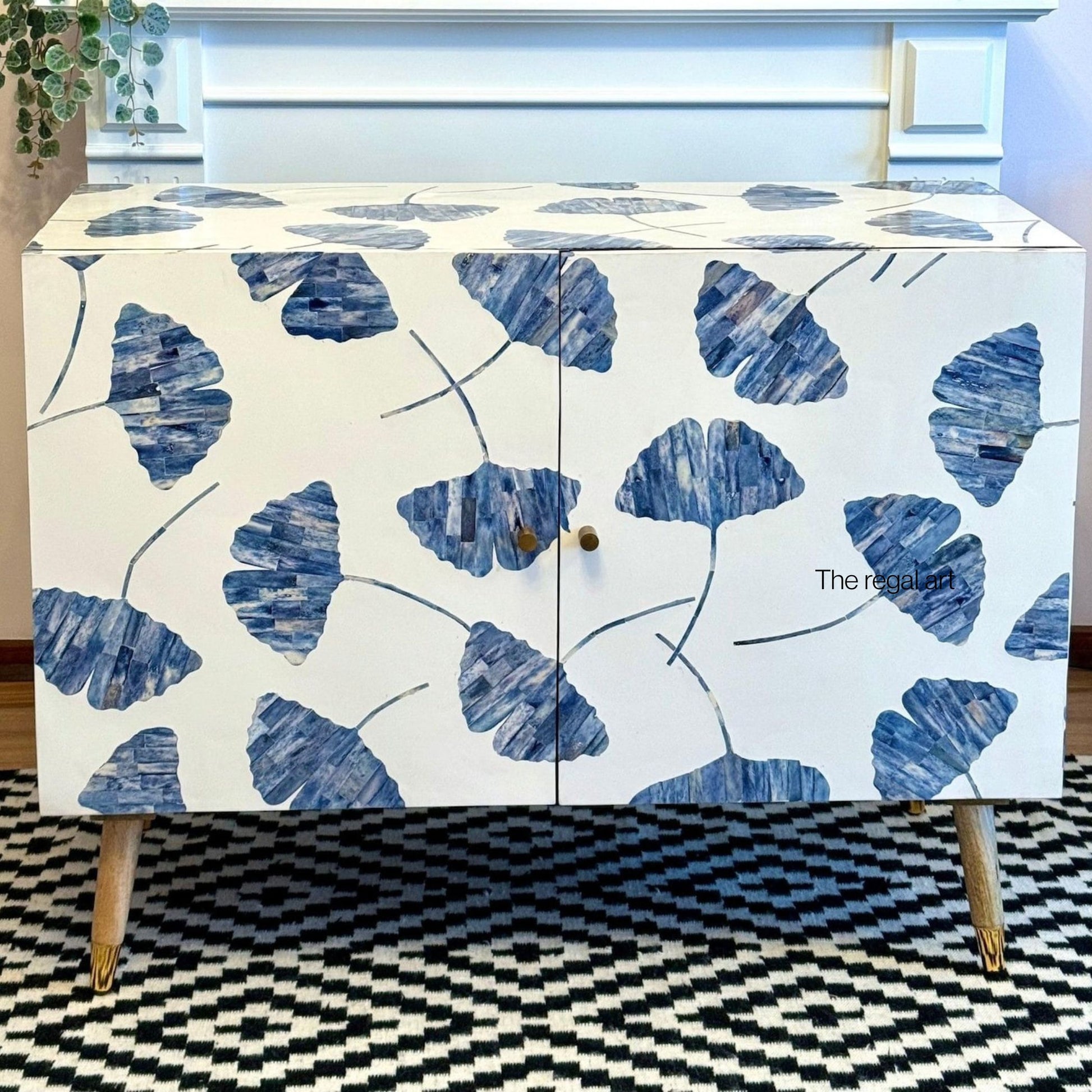 Cabinet with blue leaf pattern on a white background